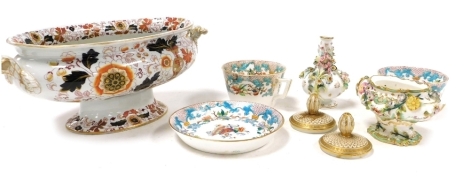 A group of 19thC English pottery and porcelain, including an ironstone vegetable tureen, two breakfast cups and a saucer, and a Rockingham type floral encrusted porcelain vase. (8)