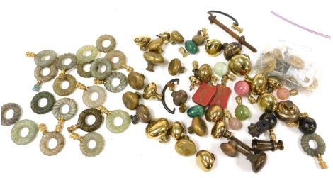 Brass hardstone and jadeite door knobs, rings, and other furniture accoutrements.