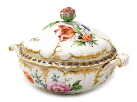 A 19thC Furstenberg porcelain ecuelle and cover, of lobed form, painted with sprays of flowers, gilt heightened, painted marks, 18cm wide.