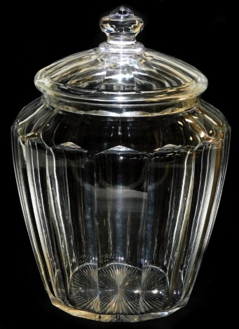 An early 20thC cut glass jar and cover, with faceted sides, 29cm high.