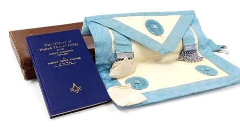 A Masonic apron, together with a book by Robert Teasdel, The History of United Friends Lodge Number 9313, Great Yarmouth 1707-1730, leather cased.