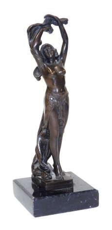 After Leon Noel Delagrane (French 1872-1910). A bronze figure of a standing dancer, semi clad, raised on a black marble base, 31.5cm high.