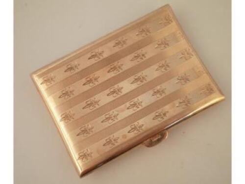 A 9ct gold cigarette case with engine turned and fleur de lys decoration