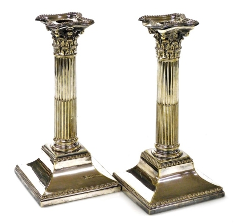 A pair of Victorian silver plated Corinthian column candlesticks, with loaded bases, 23cm high.