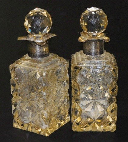 A pair of late Victorian cut glass and silver mounted decanters, with stoppers, London 1897, 19cm high.