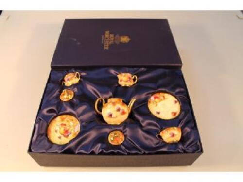 A Royal Worcester bone china miniature tea for one service painted with