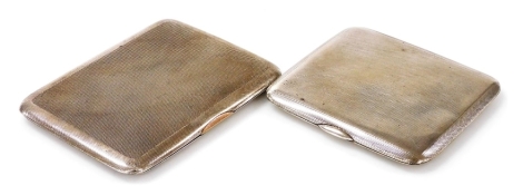 Two George V silver cigarette cases, each with engine turned decoration, Walker and Hall, Chester 1929, 5.10oz, 11cm wide, and the other engraved to interior R.P. Tucker 1920 1941, Clark & Sewell (James Clark & John Sewell), Birmingham 1937, 4.70oz, 9.5cm