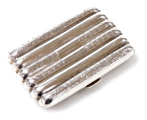 A George V silver cigarette case, the body of ribbed form decorated with bright cut bamboo shoot and foliate engraving, Albert Jackson, Birmingham 1913, 2.42oz gross.