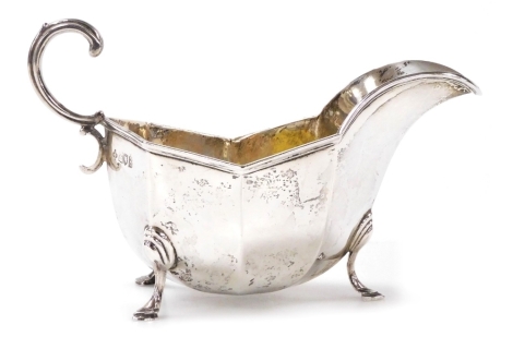 A George V silver sauce boat, of octagonal form raised on three hoof feet, Horace Woodward & Co Ltd London 1913, 4.98oz.