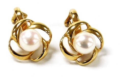 A pair of 9ct gold and cultured pearl earrings, of scrolling floral form, boxed, 3.9g.