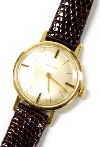 A Zenith lady's 9ct gold cased wristwatch, champagne dial with gold batons at quarters, plain case, on a leather strap.