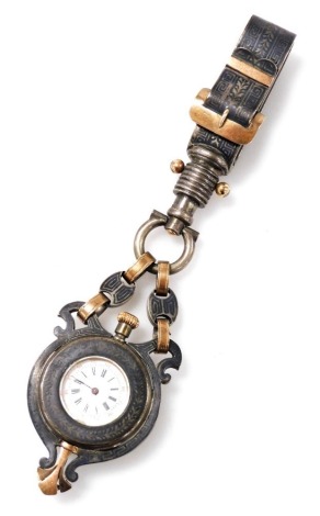 A late 19thC French niello chatelaine watch, open faced, keyless wind, circular enamel dial bearing Roman and Arabic numerals, glass backed movement, the case niello Greek key decorated on white metal, with a double chain link and belt and buckle clip sus