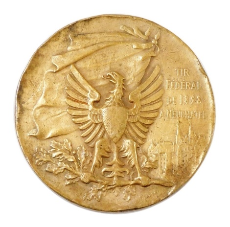 A 19thC Swiss shooting related bronzed medallion, the observe depicting an eagle and the phrase 'Tir Federal de 1898 a Neuchatel' and verso various figures shooting, 4.5cm diameter.