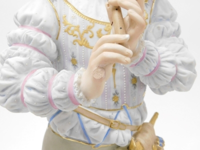 A pair of late 19thC French bisque porcelain figures, modelled as a gallant and lady in 16thC costume, the gallant standing playing a recorder, against a fluted column, the lady playing a lute, both raised on a circular socle base, 59cm high. (AF) - 4