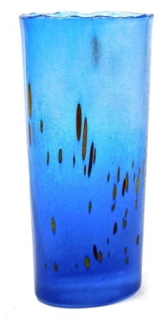 A Kosta Boda blue glass vase, of compressed cylindrical form, with flashes of browns and yellows, signed to underside Kosta Boda, B Vallien, Y9605, 20cm high.