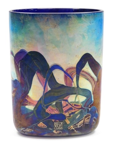 A Michael Harris Isle of Wight glass 'Nightscape' vase, of compressed form, decorated with iridescent trails against a blue ground, with paper label and signed to underside, 16.5cm high. AUCTIONEER ANNOUNCE - There is in fact no signature to the underside