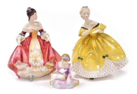 Three Royal Doulton porcelain figures, modelled as The Last Waltz, HN2315, Southern Belle, HN2229, and Mary Had A Little Lamb, HN2048.