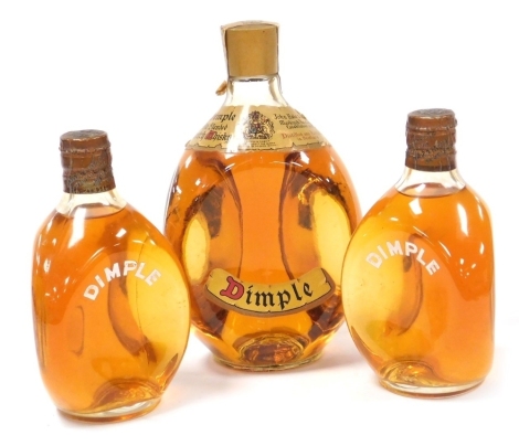 Three bottles of Dimple old blended Scotch whisky, 21cm high (1), and 17cm high (2).