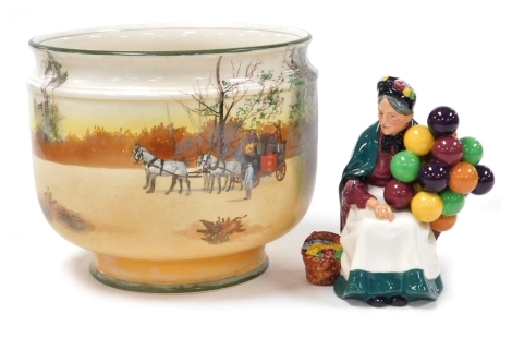 A Royal Doulton figure modelled as The Old Balloon Seller, HN1315, together with a Royal Doulton series ware jardiniere, of cylindrical form, decorated with figures, horse and coach, etc., printed marks, 22cm high.