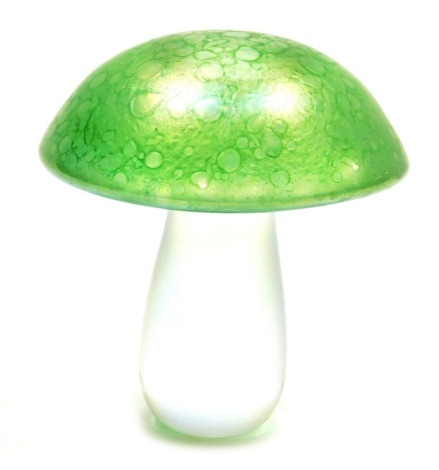 A green iridescent glass mushroom paperweight, possibly by John Ditchfield, unsigned, 12cm high.