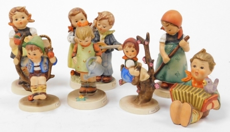 Eight Goebel Hummel porcelain figures, comprising Lets Sing, Sister, Little Gardener, Apple Tree Girl, Happy Days, Apple Tree Boy, and Little Sweeper. (AF)