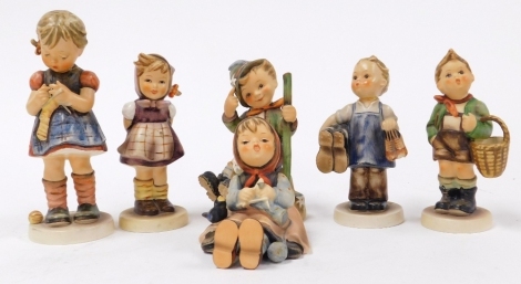 Six Goebel Hummel porcelain figures, comprising Mountaineer, Village Boy, Happy Pastime, Stitch In Time, and two further figures. (AF)