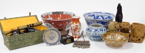 A group of Oriental related items, to include a blue and white bowl decorated with dragons, six character mark to underside, 24cm diameter, Satsuma bowl, 15cm wide, and a carved wooden figure of a gentleman on horseback, 22cm high, etc. (a quantity)