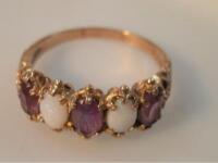 An opal and amethyst dress ring