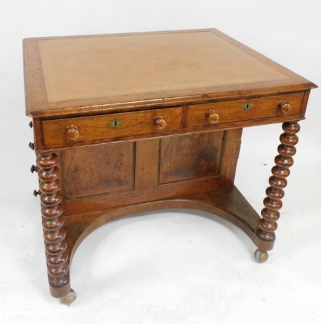 A Victorian pollard oak Davenport desk, with a tooled tan leather top, over a pair of frieze drawers with five drawers to each side, raised on turned columns above a recessed base, on castors, 80cm high, 92cm wide, 75cm deep.