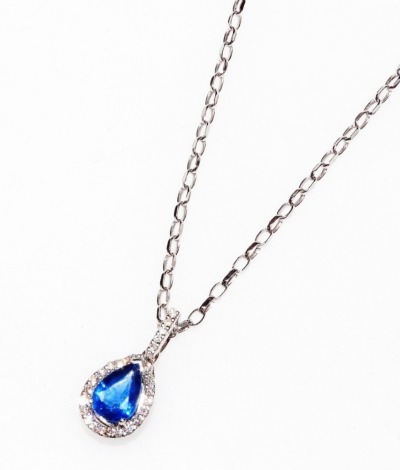 An 18ct white gold sapphire and diamond pendant, of teardrop form, on a belcher link neck chain, with bolt ring clasp, 3.2g.