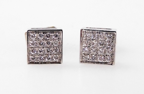 A pair of 18ct white gold and diamond stud earrings, each square form setting holding sixteen diamonds, by Jonathan Lynne, approximately 0.18ct.