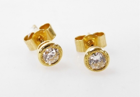 A pair of 18ct gold and diamond single stone stud earrings, by Jonathan Lynne, approximately 0.3ct.