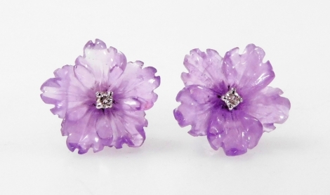 A pair of 18ct white gold, diamond and amethyst floral stud earrings.