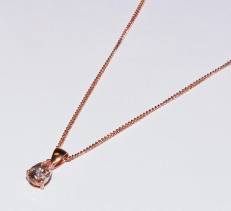 A 9ct gold rose gold and morganite pendant, with a pear shaped stone, on a curb link neck chain, with bolt ring clasp, 2.7g.