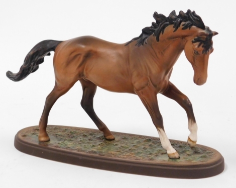 A Royal Doulton matt porcelain figurine modelled as The Winner, DA154, mounted on an oval base, 20cm high, boxed.