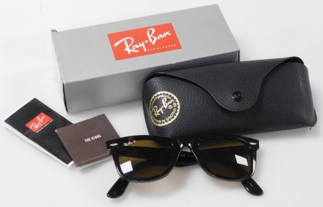 A pair of Rayban Wayfarer sunglasses, with tortoiseshell frames and polarised lenses, with case and outer box.