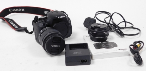 A Canon EOS 600D DSLR camera, together with battery charger, instruction manual, strap, and an EF-S 18-55mm lens, and a macro 0.3m/0.98ft lens.