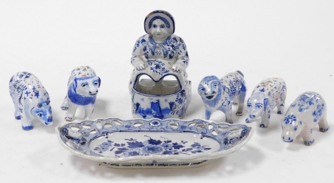 A group of 19thC and later Delftware pottery, to include animal figures, pigs, lion, ram, an oval dish, with a pierced outer border and moulded female figures, internally painted with flowers, 22cm wide.