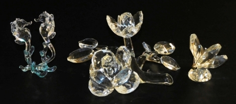 A group of Swarovski crystal and other animals, comprising a butterfly, pair of seahorses, boxed, and a floral sculpture.