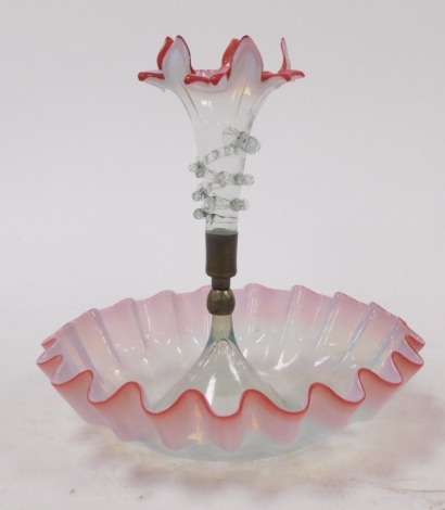 A Victorian vaseline glass single epergne, central vase of floral trumpet form, in pinks and blues, the base of circular bowl shaped form, with a waved border, 25cm diameter.