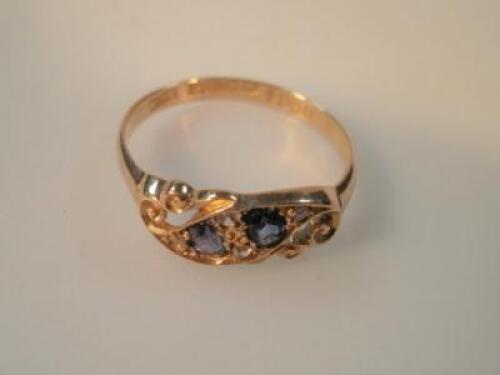 An sapphire set ring, shank stamped 18ct, 2