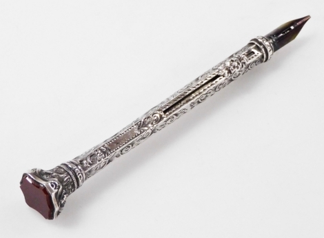 A Victorian silver propelling pencil and pen, with engraved foliate decoration, carnelian set vacant shield terminal, Chester 1894.