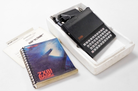 A Sinclair ZX81 computer, boxed, with leads, charger, and instruction manuals.