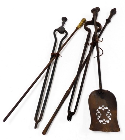 Assorted Victorian and later fire irons, with various handles, comprising two pokers, two coal tongs, and a shovel.