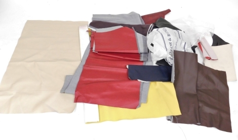 A quantity of leather and other fabric offcuts, in different colours. (1 box)