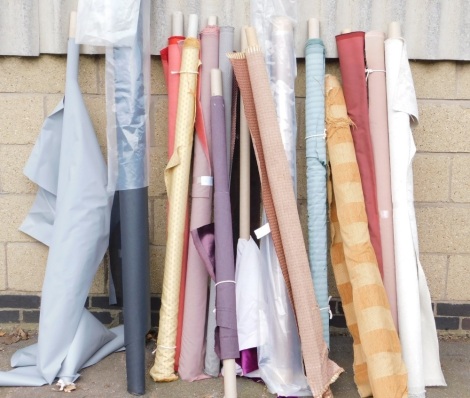 Various rolls of fabric, in differing colours and designs.