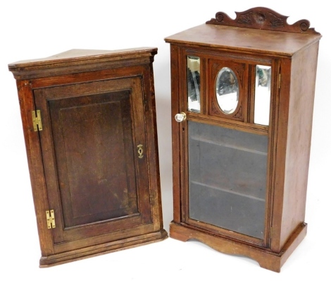 A Victorian mahogany side cabinet, with a glazed and mirrored door, raised on bracket feet, 95.5cm high, 51cm wide, 32cm wide, together with an early 19thC oak hanging corner cupboard, with a panelled door, 54cm high, 56cm wide, 30cm deep.