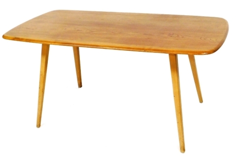 An Ercol light elm dining table, with a rectangular top, on tapering supports, the top 149cm x 74cm.