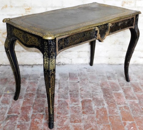 A 19thC ebonised and brass inlaid writing table, stamped Edwards and Roberts, in the French taste, the rectangular top with a dark green gilt tooled leather skiver inset surrounded by a border of scrolls and flowers, with gilt metal mounts, with a single 