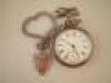 A silver open face pocket watch and Albert